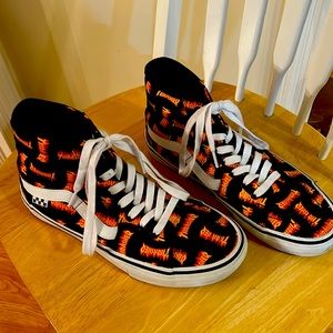 They are Thrasher Vans. Black and orange with white laces.